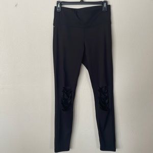 Boutique black “distressed” leggings